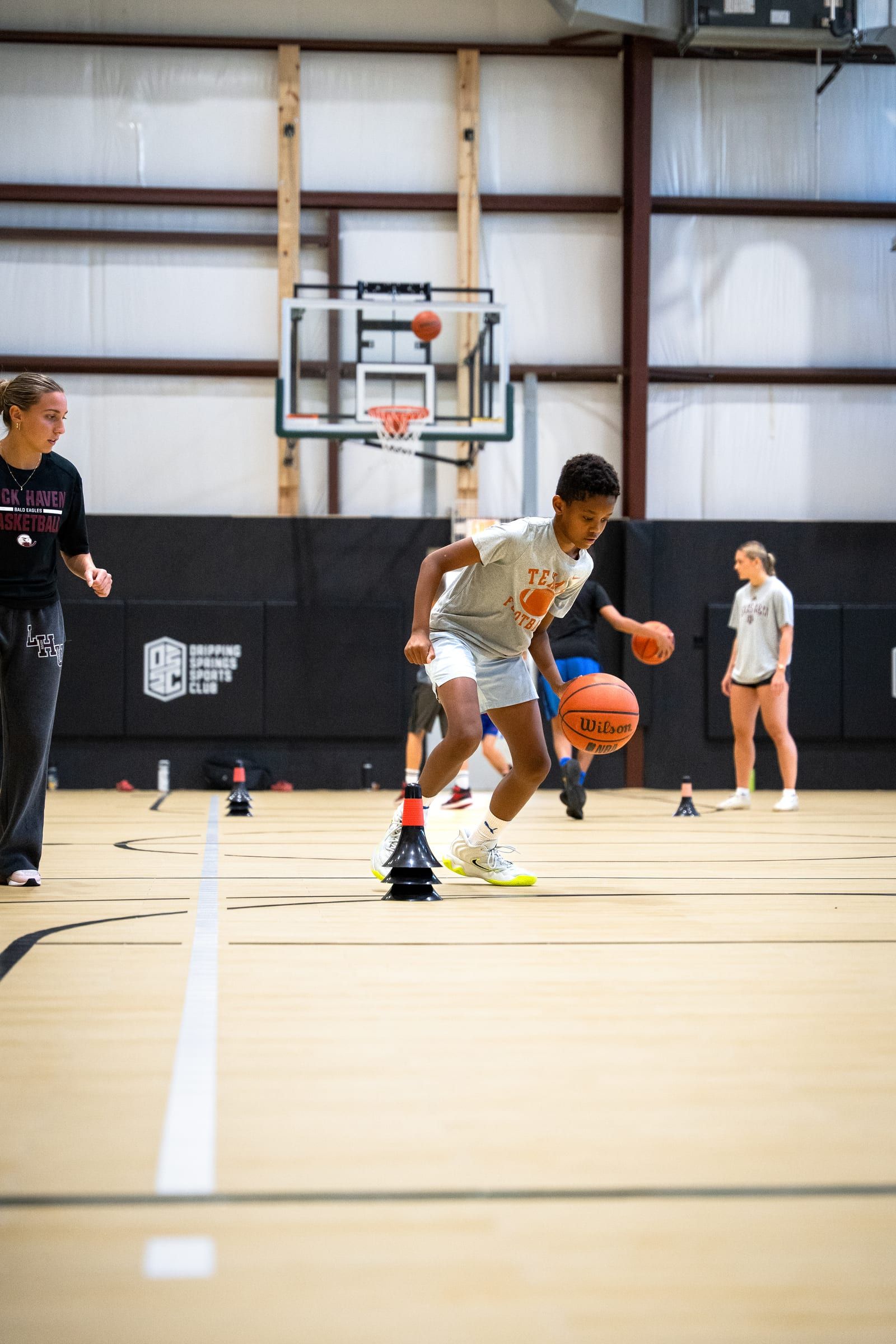 A player driving to the basket during a lab