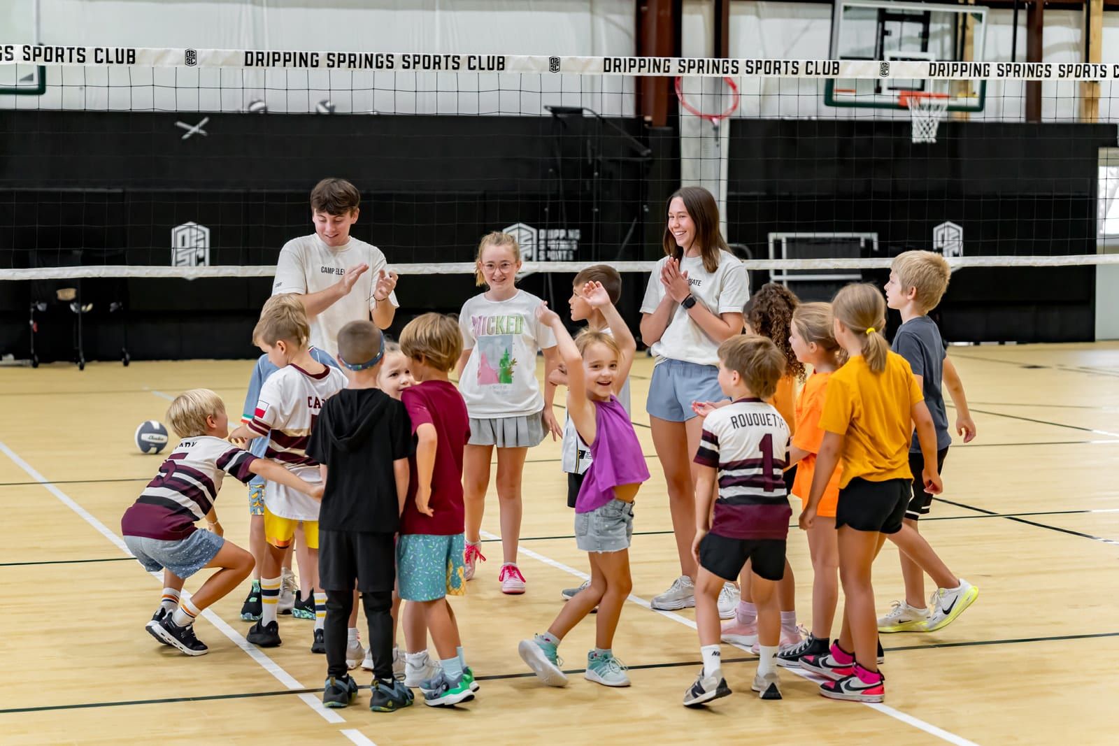Campers and coaches gathered on the court