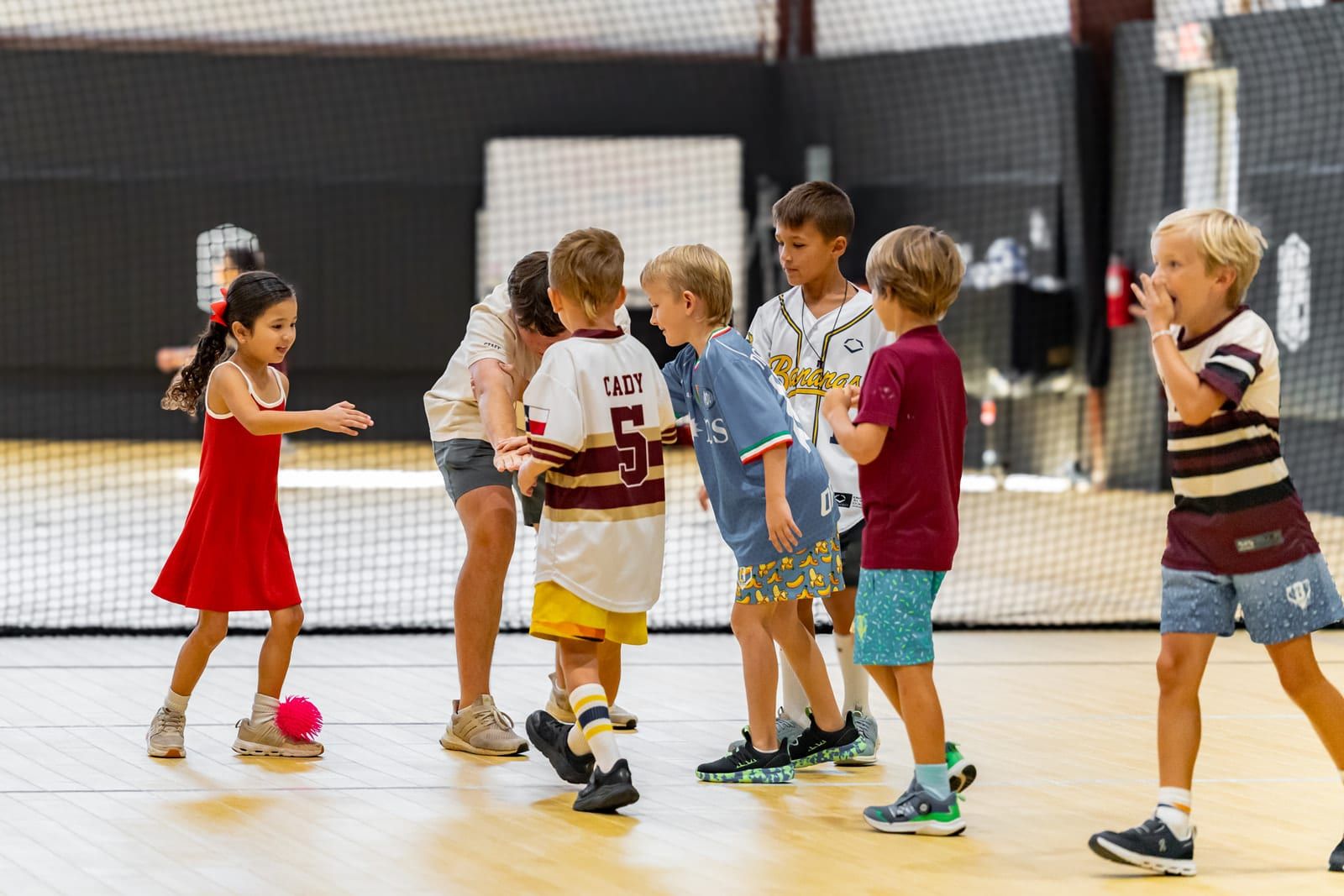Campers passing a ball in a circle game