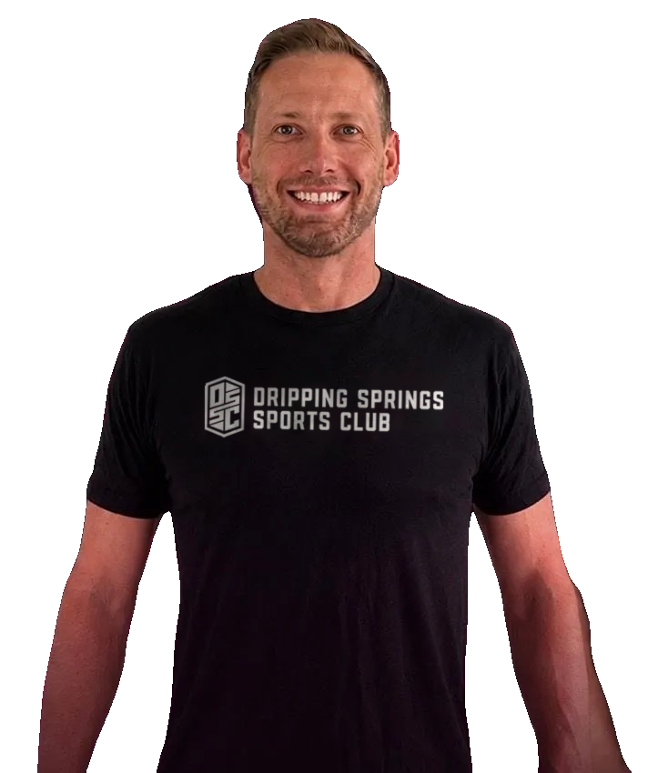 Hunter Haley, Director of Volleyball, smiling in a black Dripping Springs Sports Club shirt