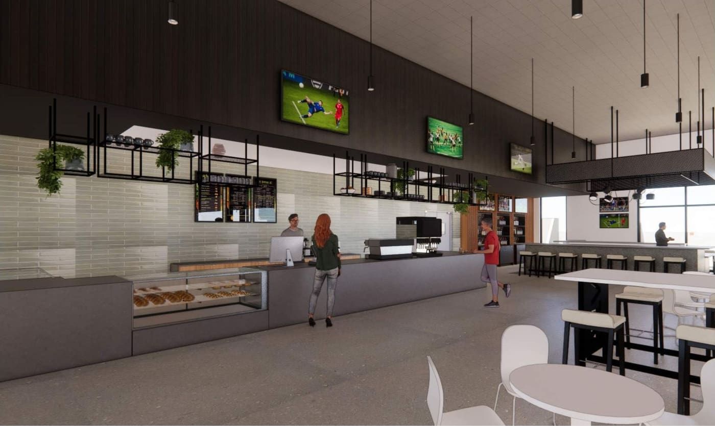Rendering of the café and bar with a long counter, pendant lights and game screens