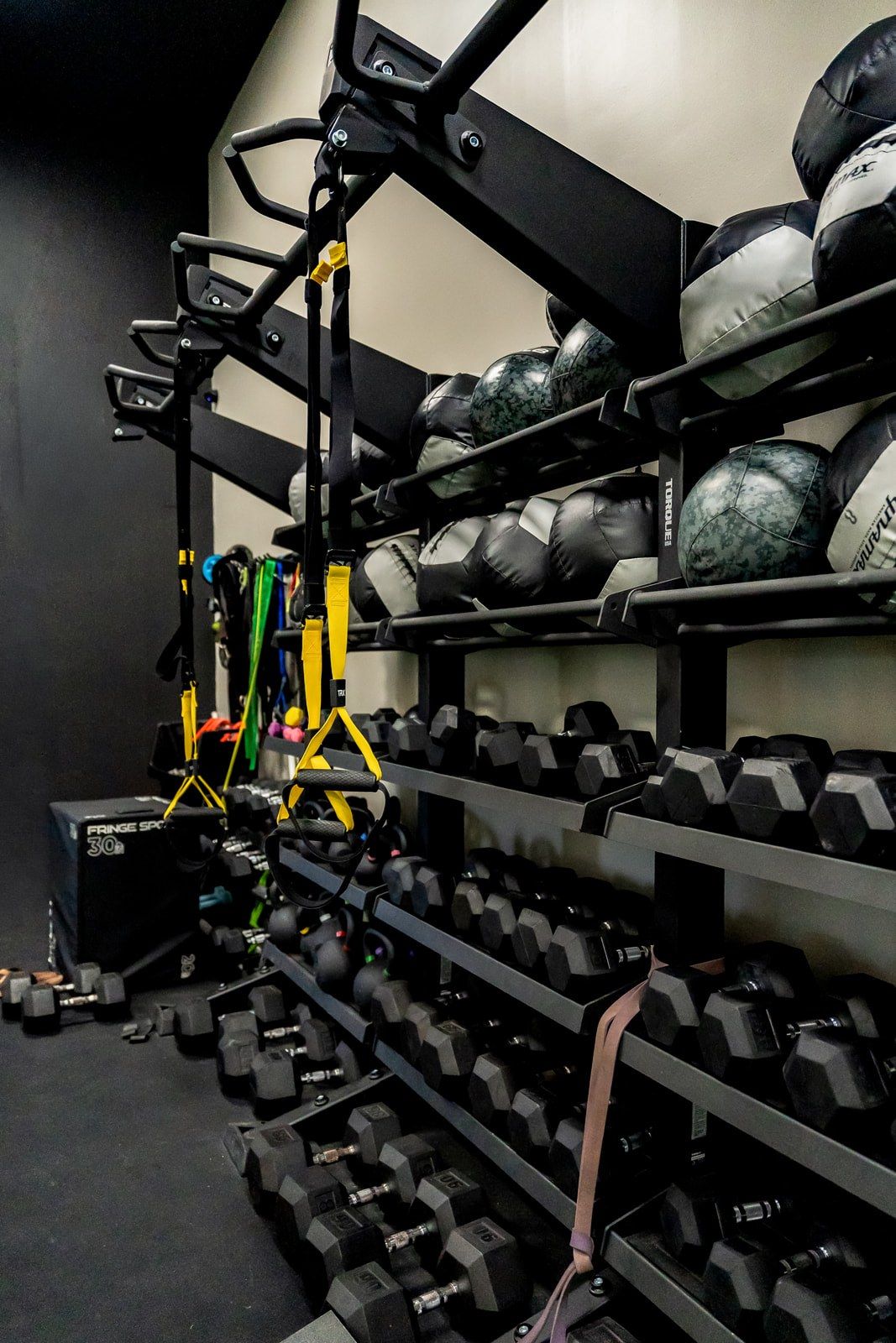 The Reach floor’s racks of medicine balls, kettlebells and dumbbells
